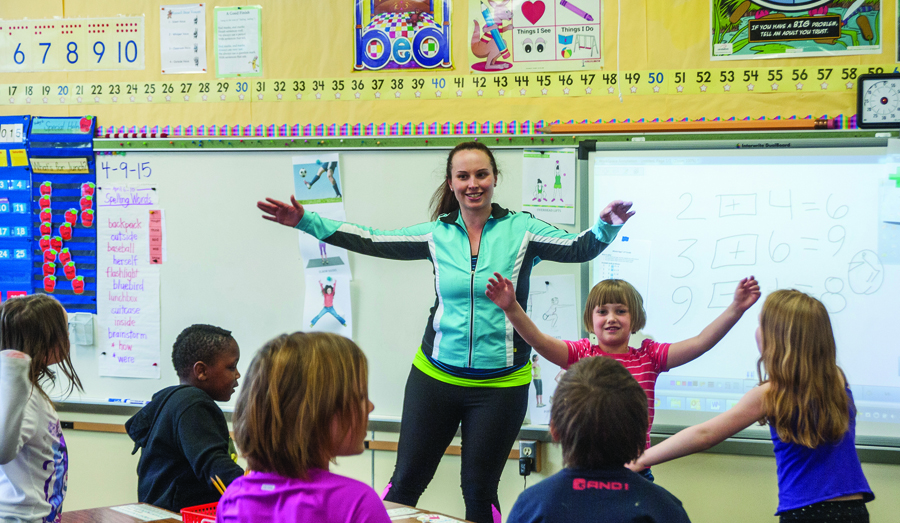 UM health enhancement student Shanel Curtis works with a group of first-graders at Missoula’s C.M. Russell Elementary School